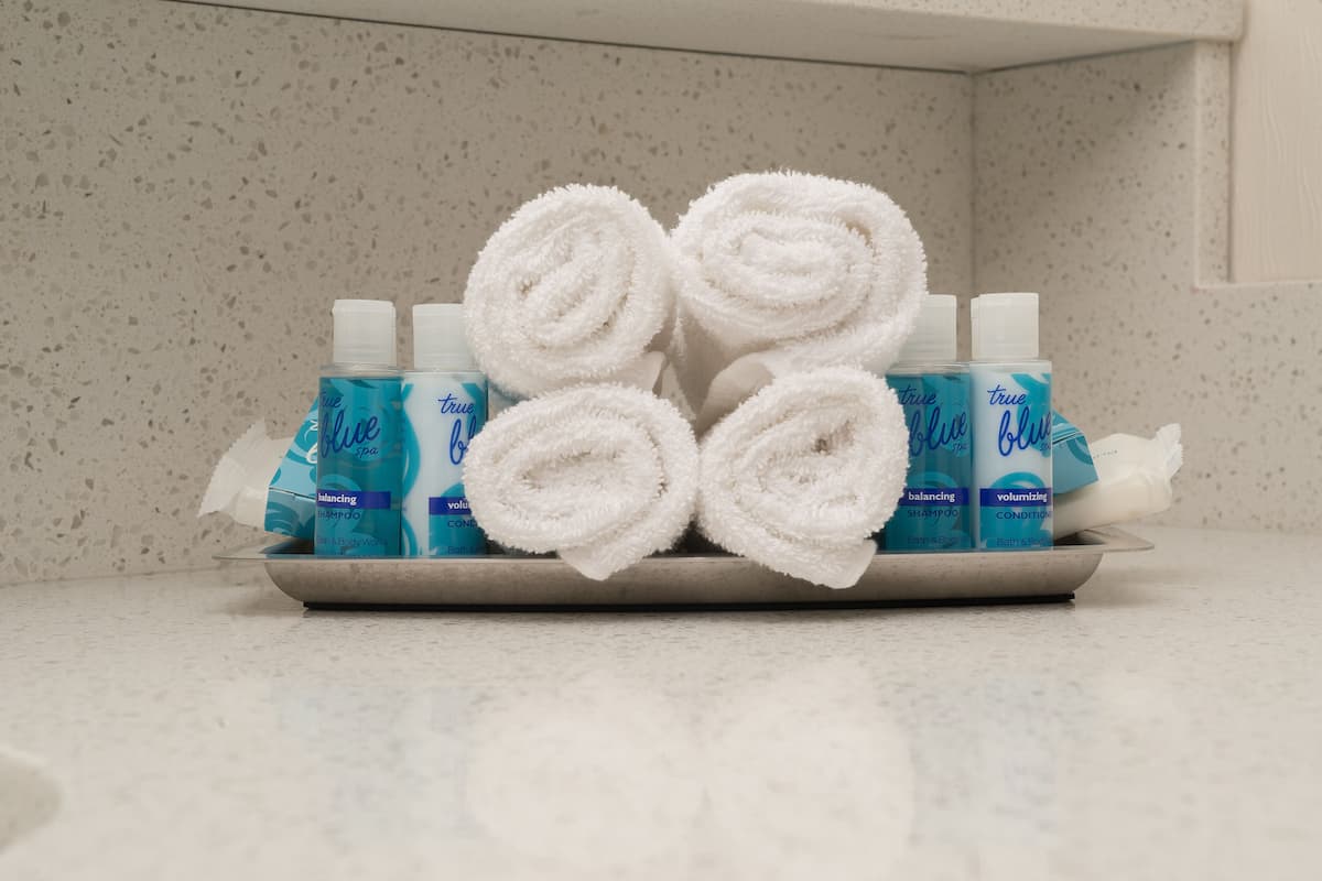 premium bedding, tempur-pedic beds, desk, laptop workspace