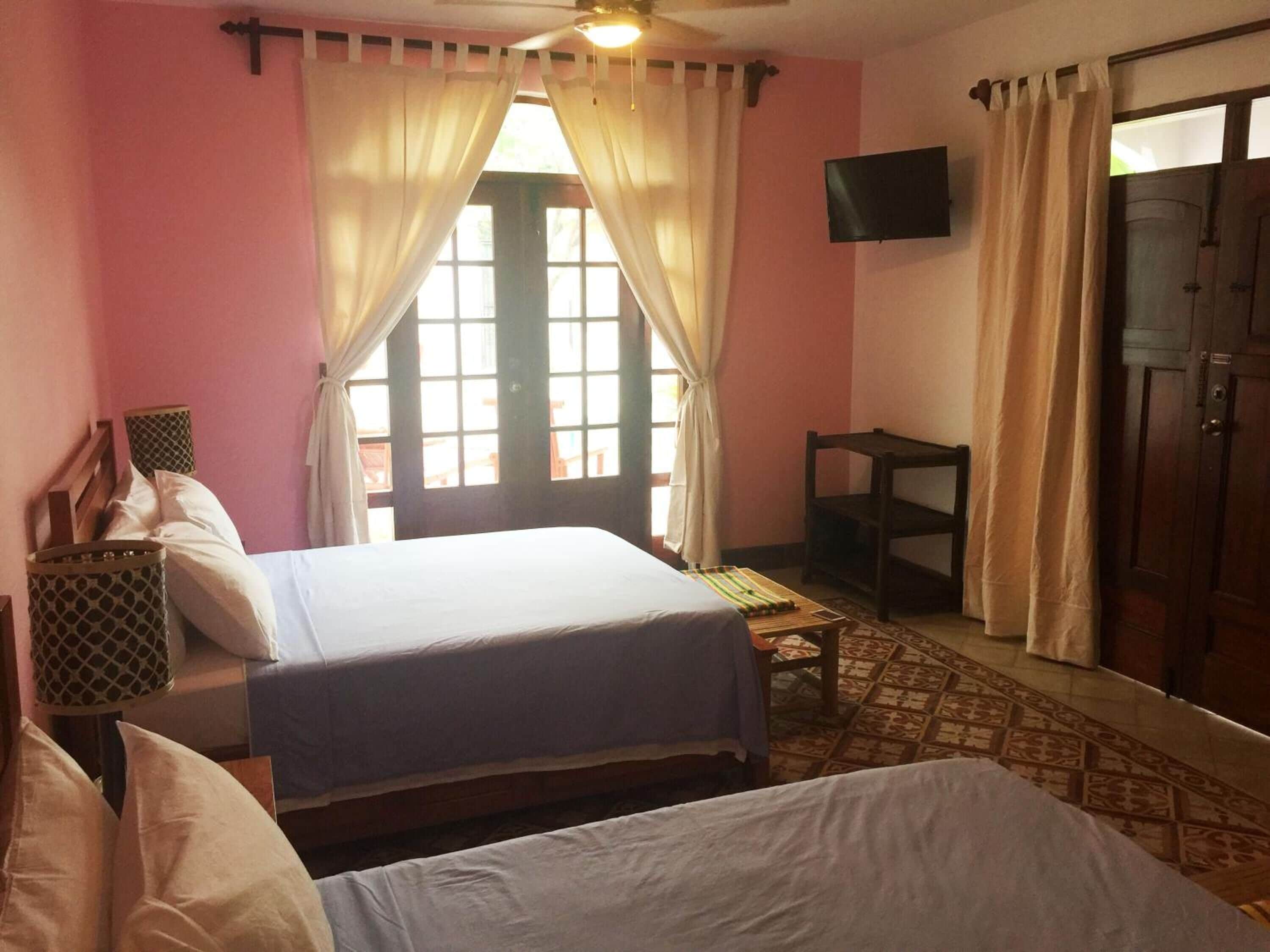 deluxe quadruple room, balcony, pool view | in-room safe, iron/ironing board, free wifi, bed sheets