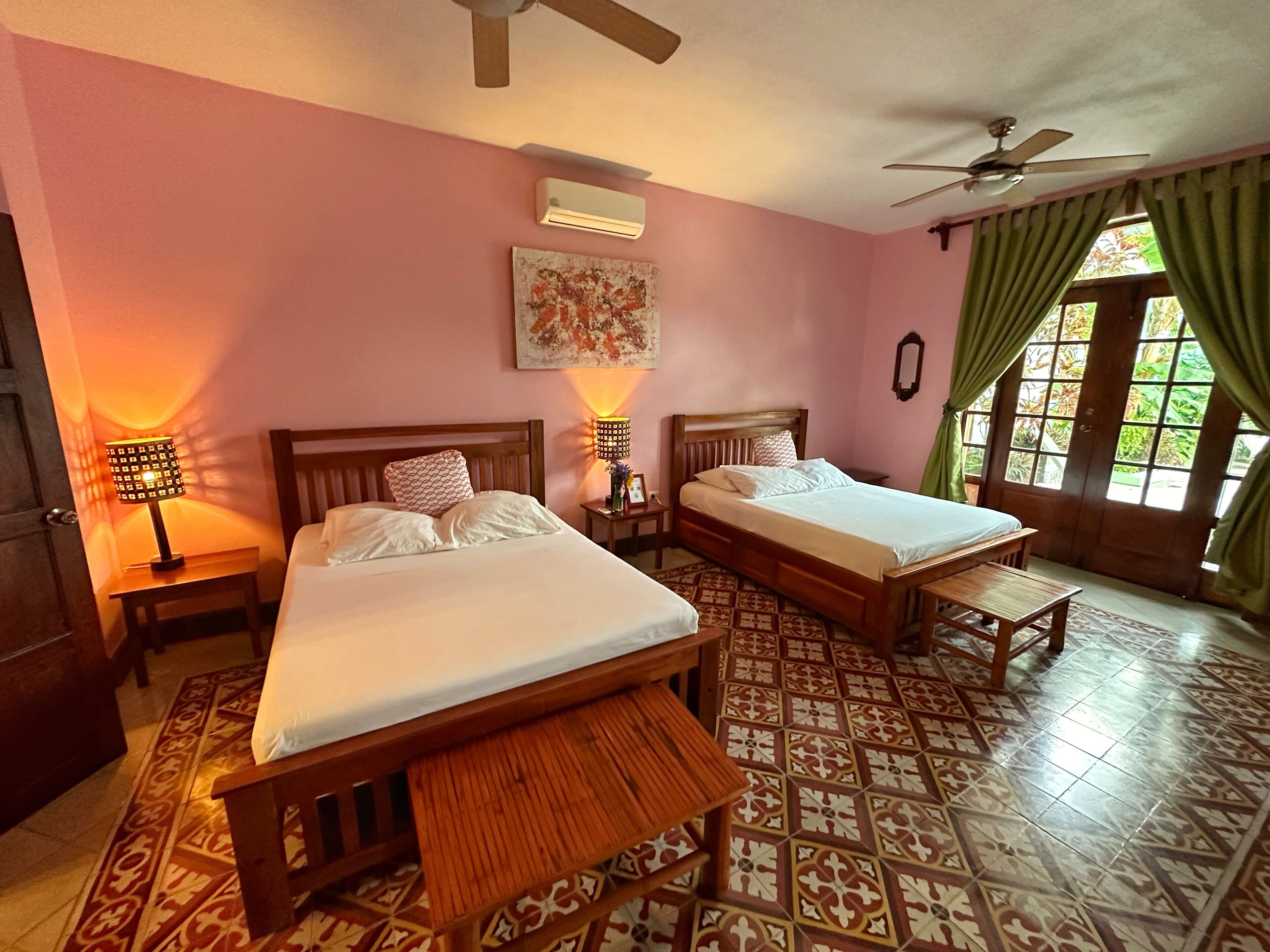 deluxe quadruple room, 2 queen beds, private bathroom | in-room safe, iron/ironing board, free wifi, bed sheets