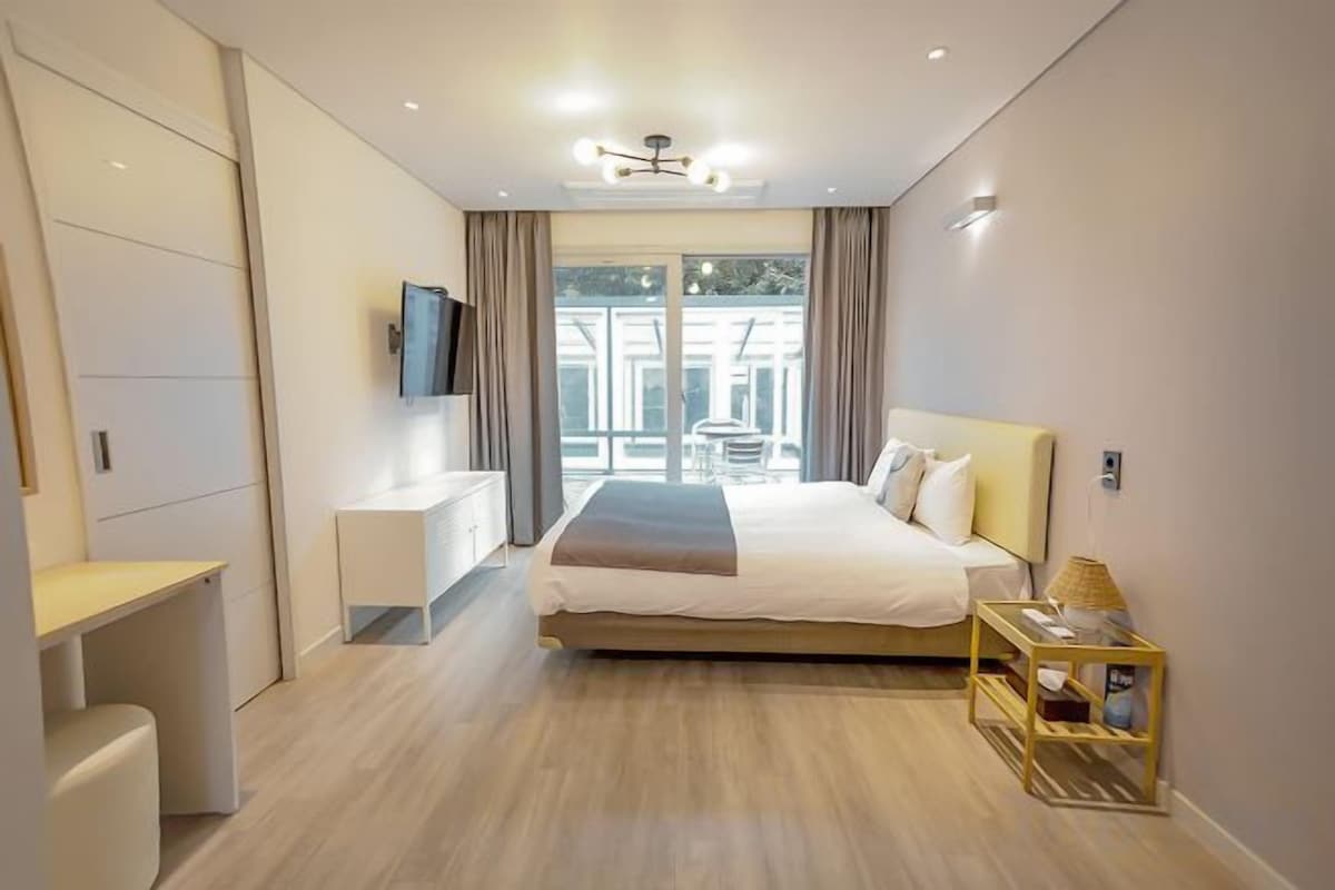 Premium bedding, blackout drapes, soundproofing, WiFi (free)