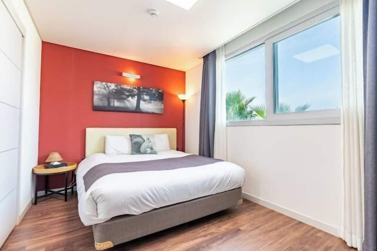 1 bedroom, premium bedding, individually decorated, blackout curtains