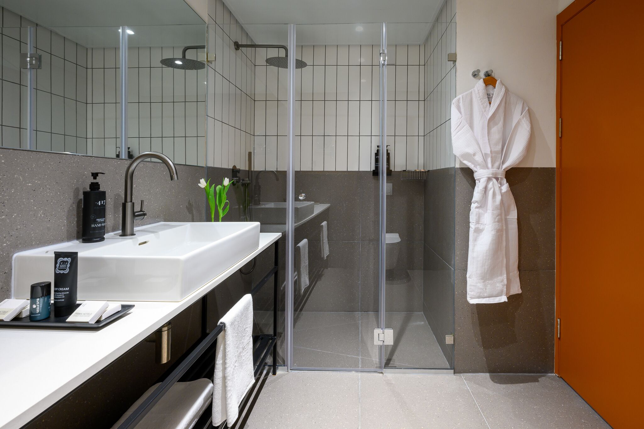 junior suite | bathroom | combined shower/bathtub, designer toiletries, hair dryer, bathrobes