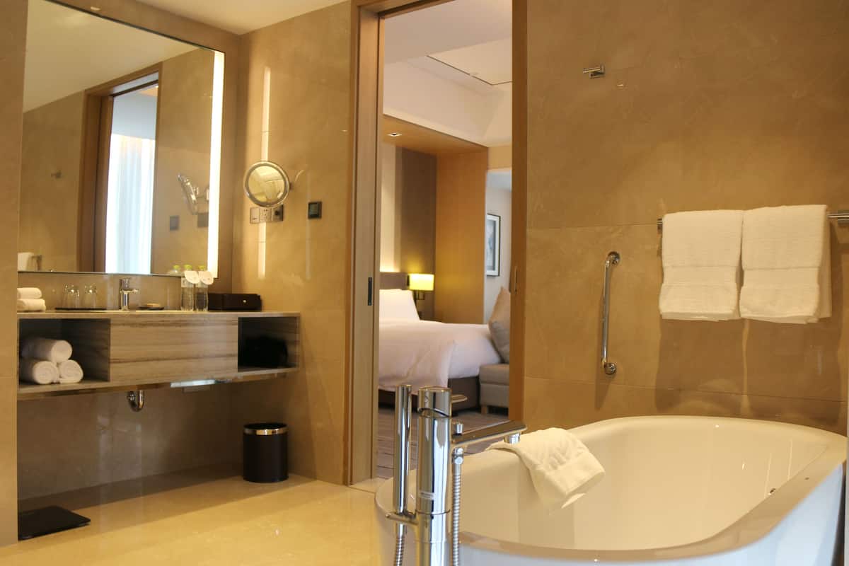 premier twin room, corner | bathroom | separate bathtub and shower, deep-soaking bathtub, rainfall showerhead