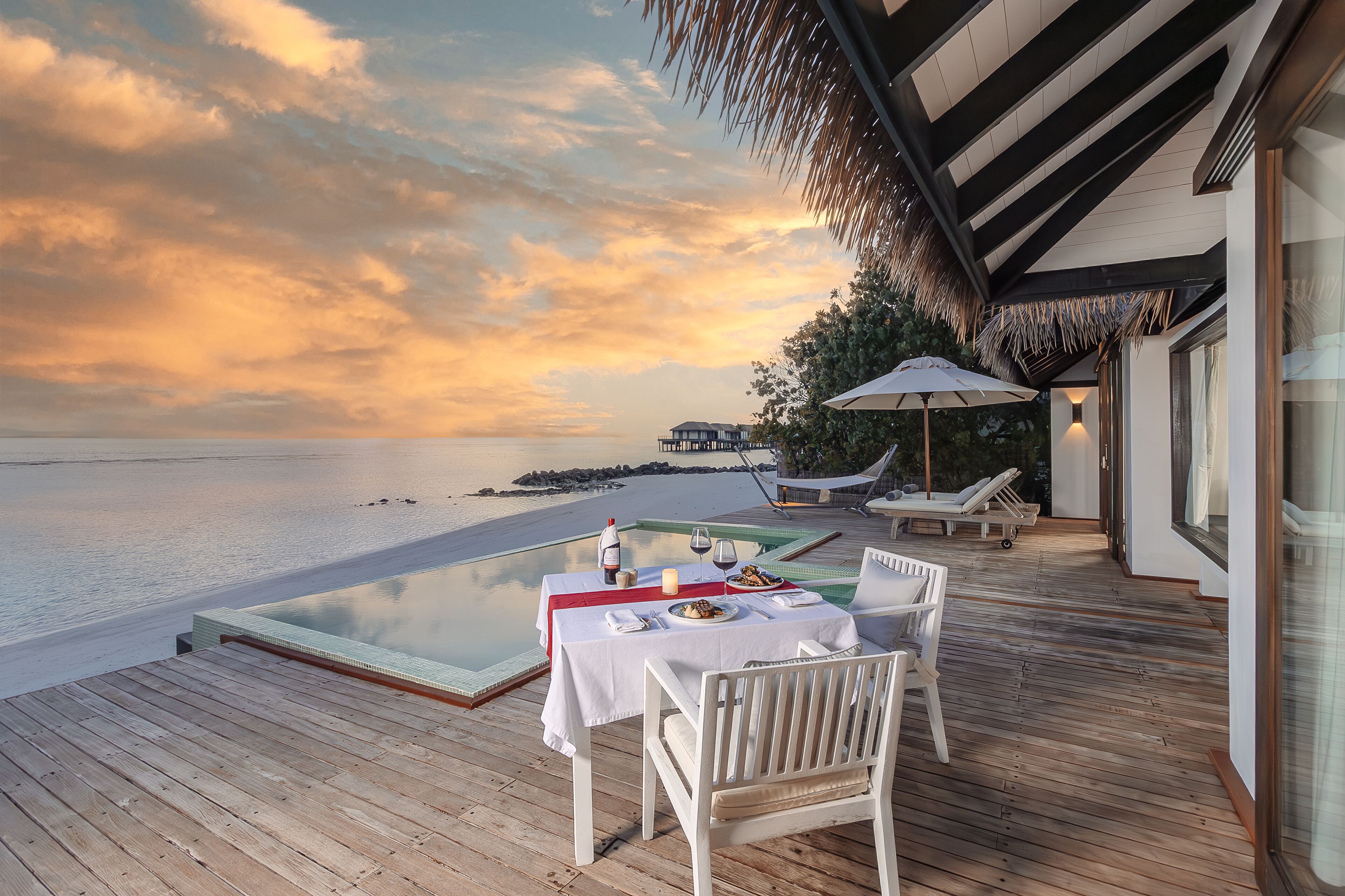 beach villa with private pool & sunset | view from room