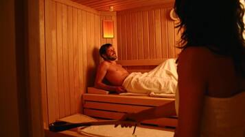 Relax in a serene sauna room with a bench and a wall-mounted heater.