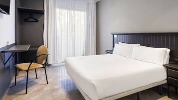 Desk, blackout curtains, free WiFi, bed sheets