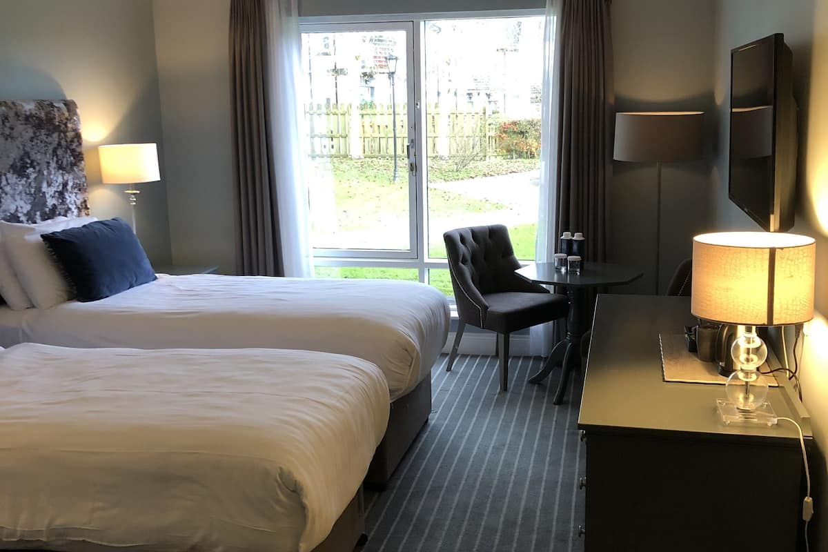 classic twin room | 1 bedroom, desk, laptop workspace, iron/ironing board