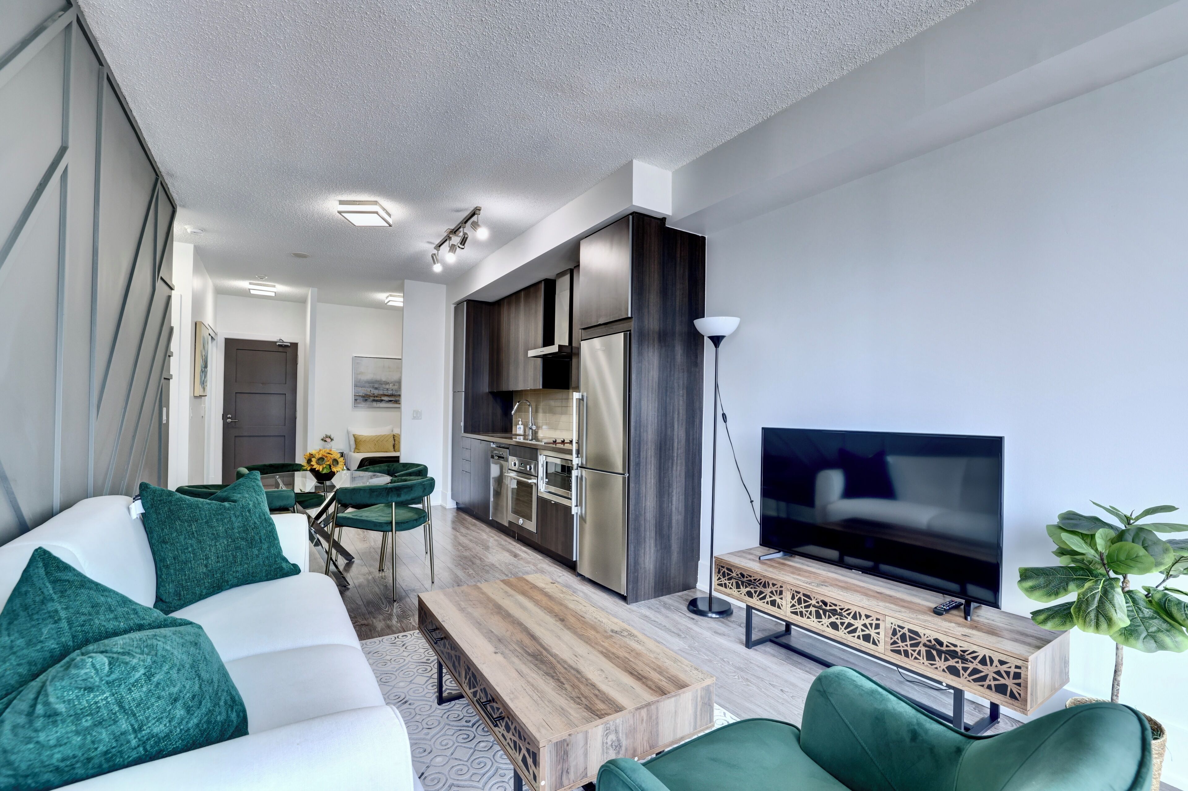 city condo, 1 queen bed, city view, tower | living area | flat-screen tv