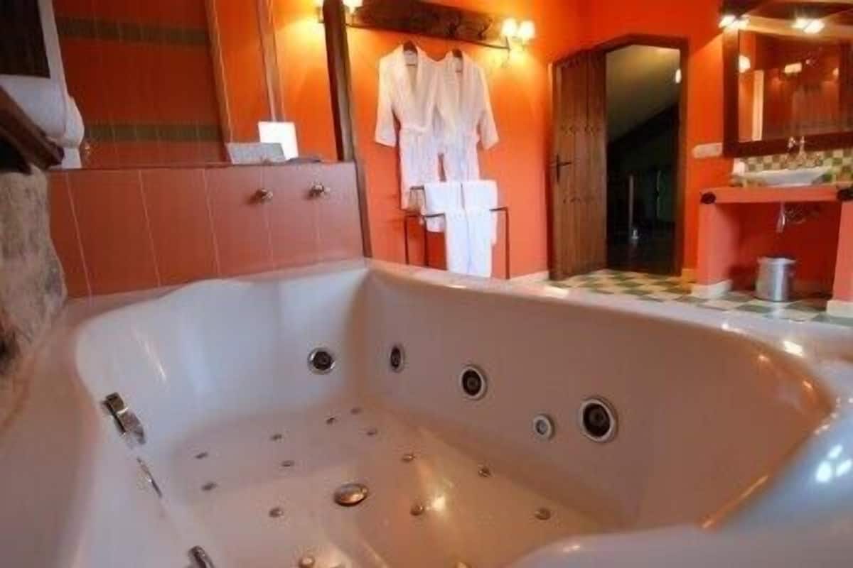 grand suite, 2 bedrooms, jetted tub, mountain view | bathroom | hair dryer, bidet, soap, shampoo