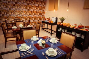 Enjoy a traditional dining experience with elegant settings and a variety of food options.