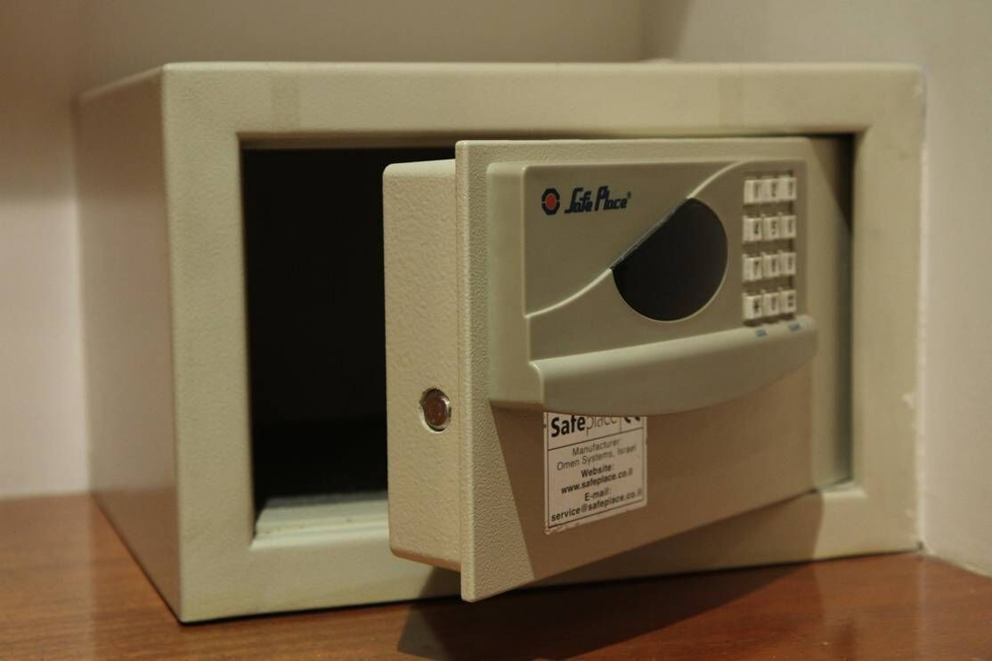 A safe deposit box with a keypad and a label indicating it is from Safe Place.