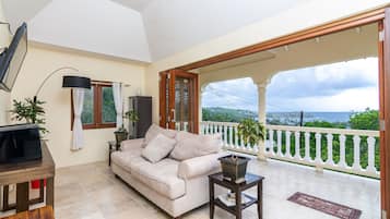 Luxury Villa, Ocean View | Living room | Flat-screen TV