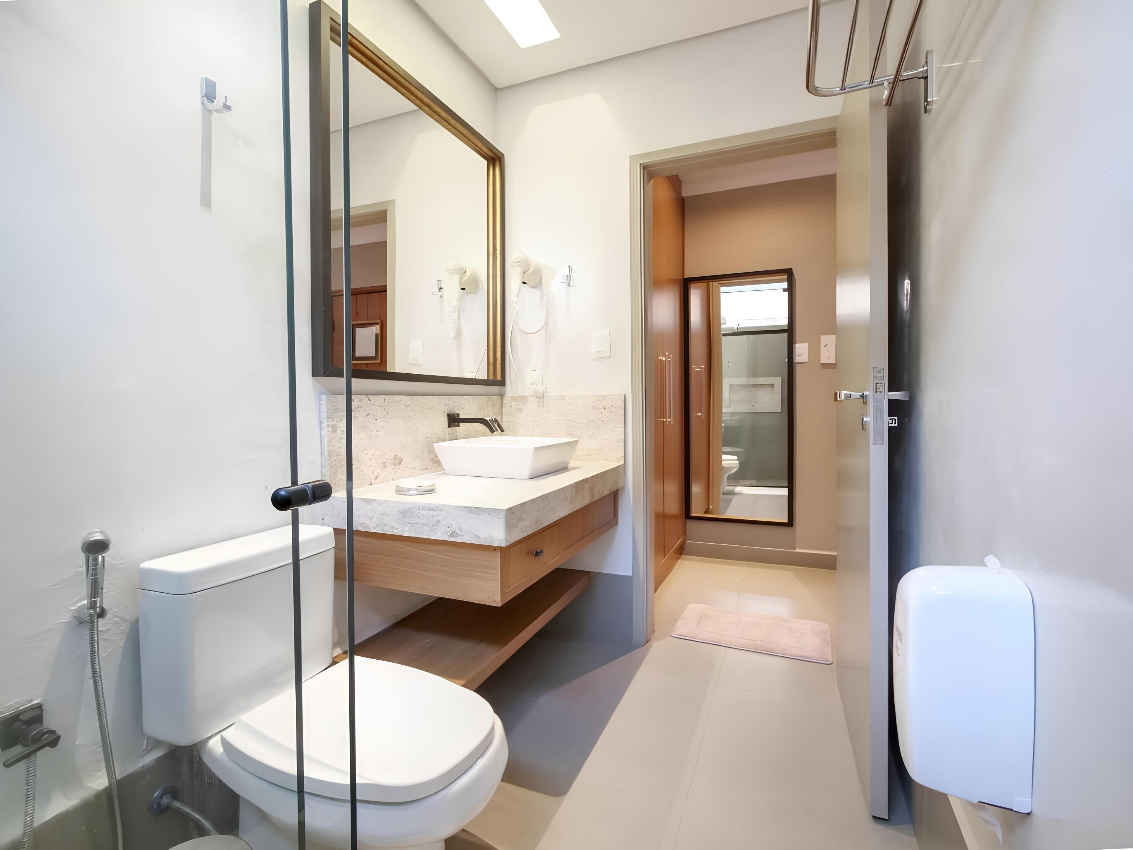 deluxe double room | bathroom | shower, hair dryer, towels, soap
