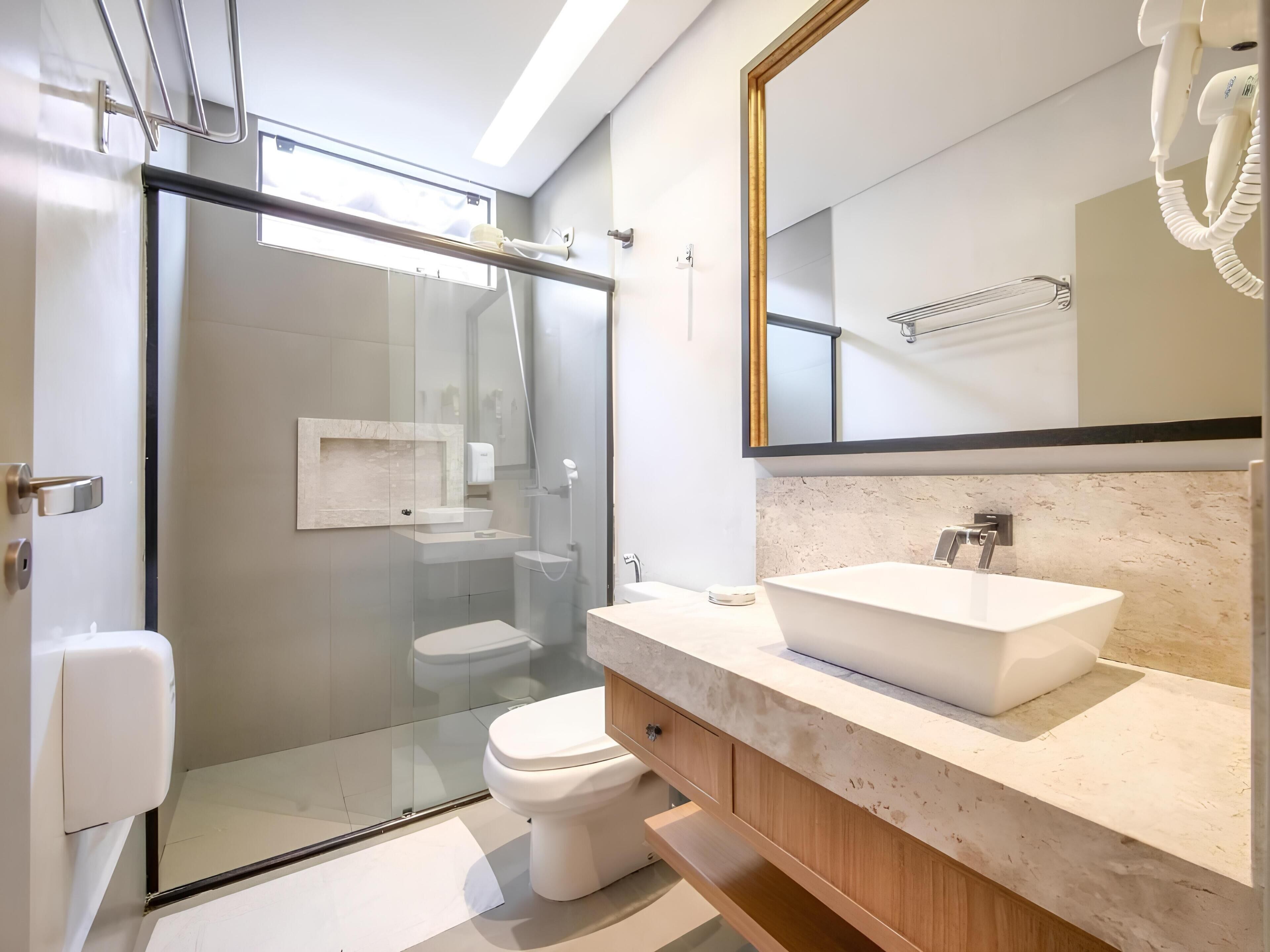 deluxe double room | bathroom | shower, hair dryer, towels, soap