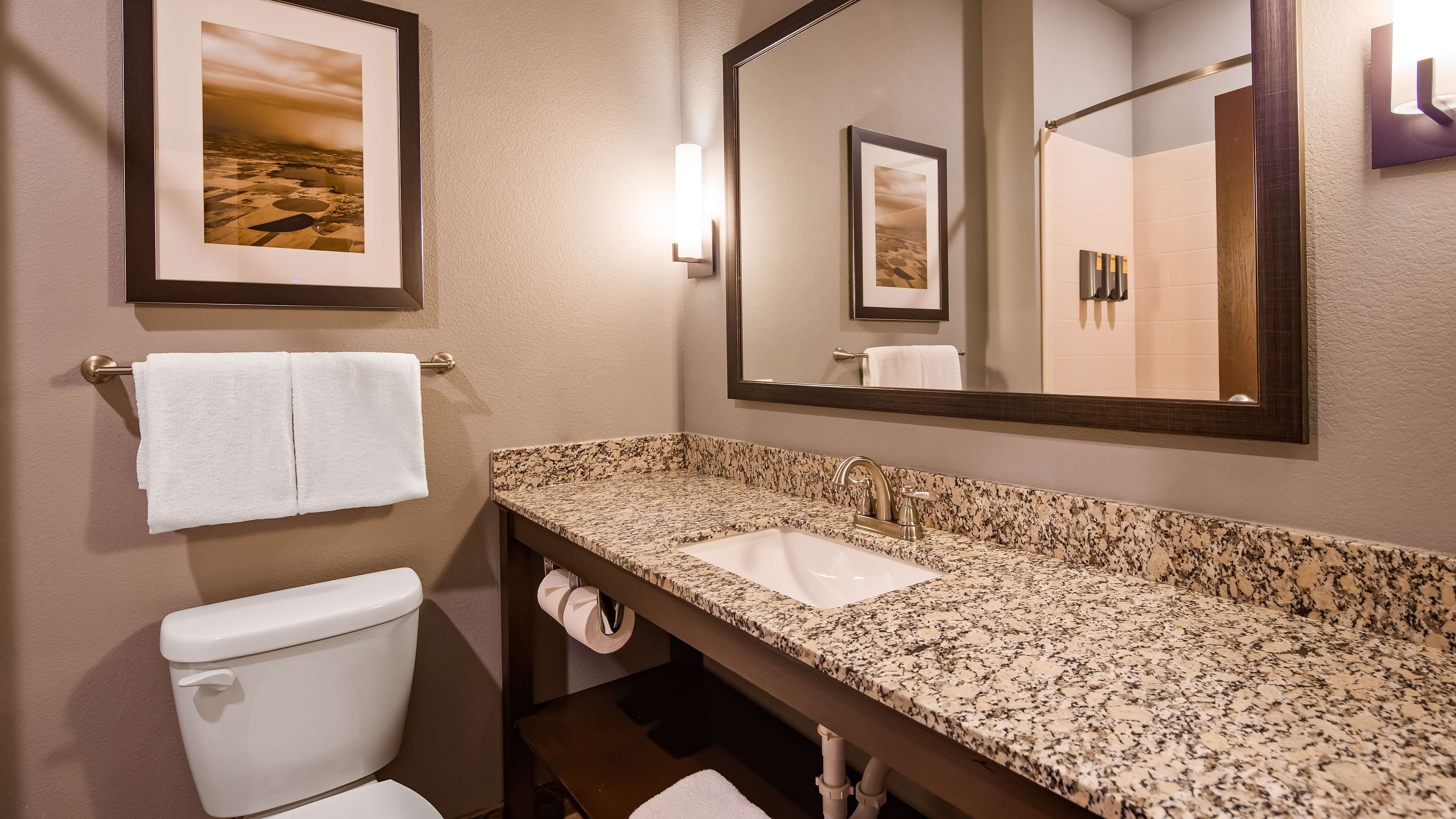 suite, 1 king bed, non smoking, refrigerator & microwave | bathroom | combined shower/bathtub, free toiletries, hair dryer, towels