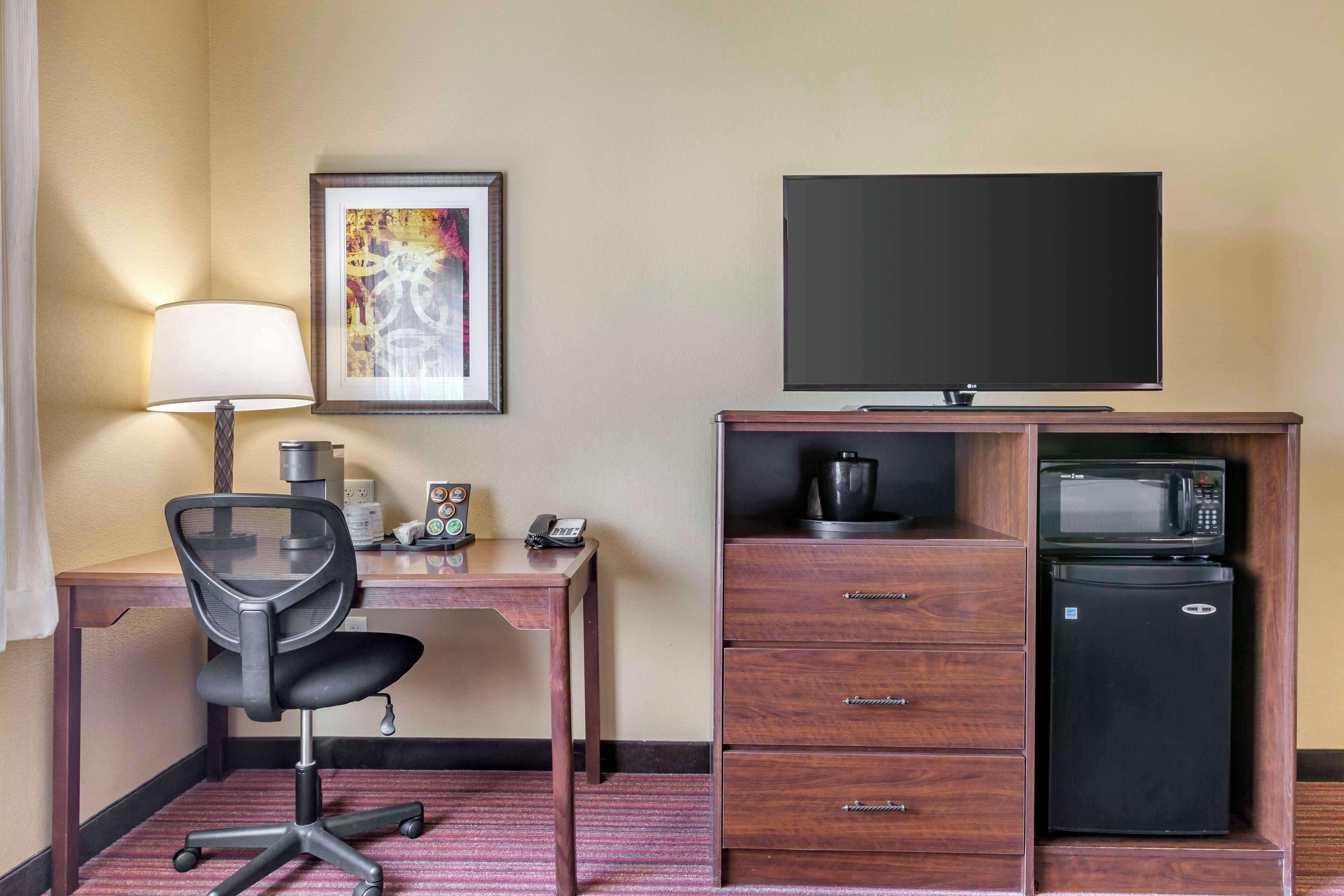 tempur-pedic beds, desk, laptop workspace, blackout curtains