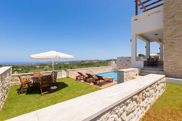 Outdoor pool, pool umbrellas, pool loungers