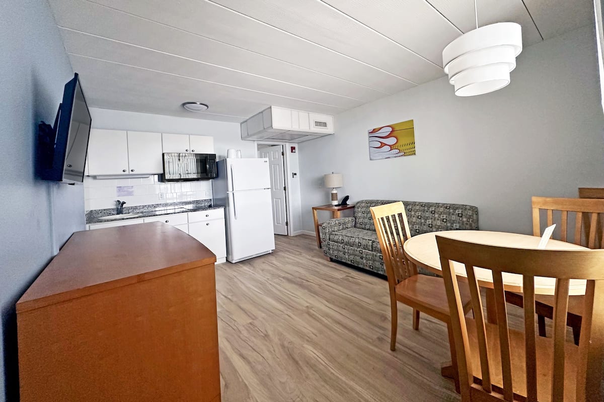 Superior Double Room, Kitchenette | Living area | TV
