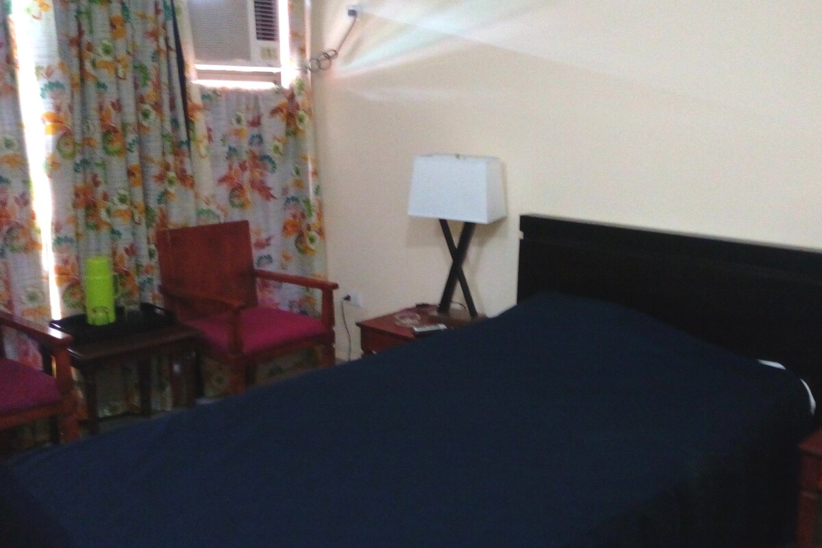 Minibar, desk, laptop workspace, bed sheets