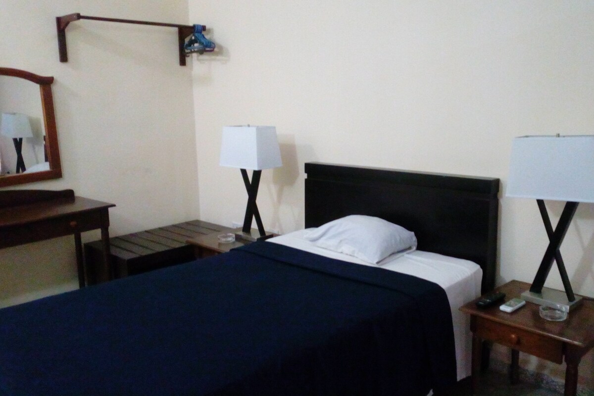 Minibar, desk, laptop workspace, bed sheets
