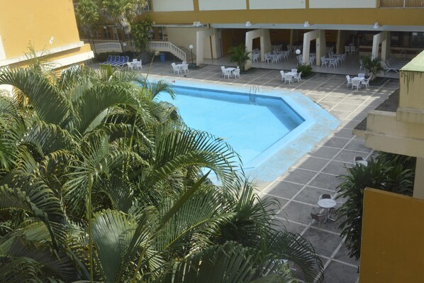 Outdoor pool, open 11 AM to 7 PM, pool loungers