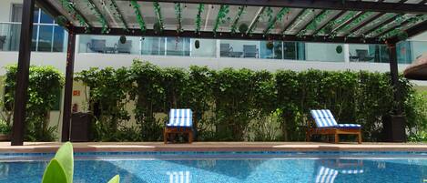 Outdoor pool, open 10:00 AM to 8:00 PM, pool umbrellas, sun loungers