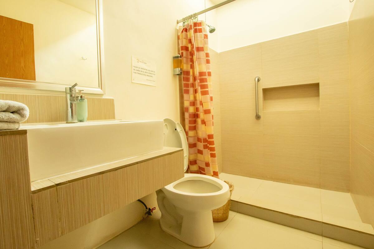 traditional double room, 2 queen beds | bathroom | shower, rainfall showerhead, free toiletries, hair dryer