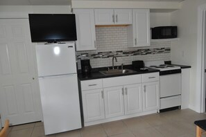 Suite, 1 cama matrimonial y sofá cama | Cocina privada | Cafetera y tetera