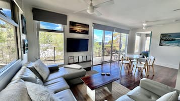 Apartment, 2 Bedrooms, Accessible, Sea View | Living area | 50-inch flat-screen TV with digital channels, TV, DVD player