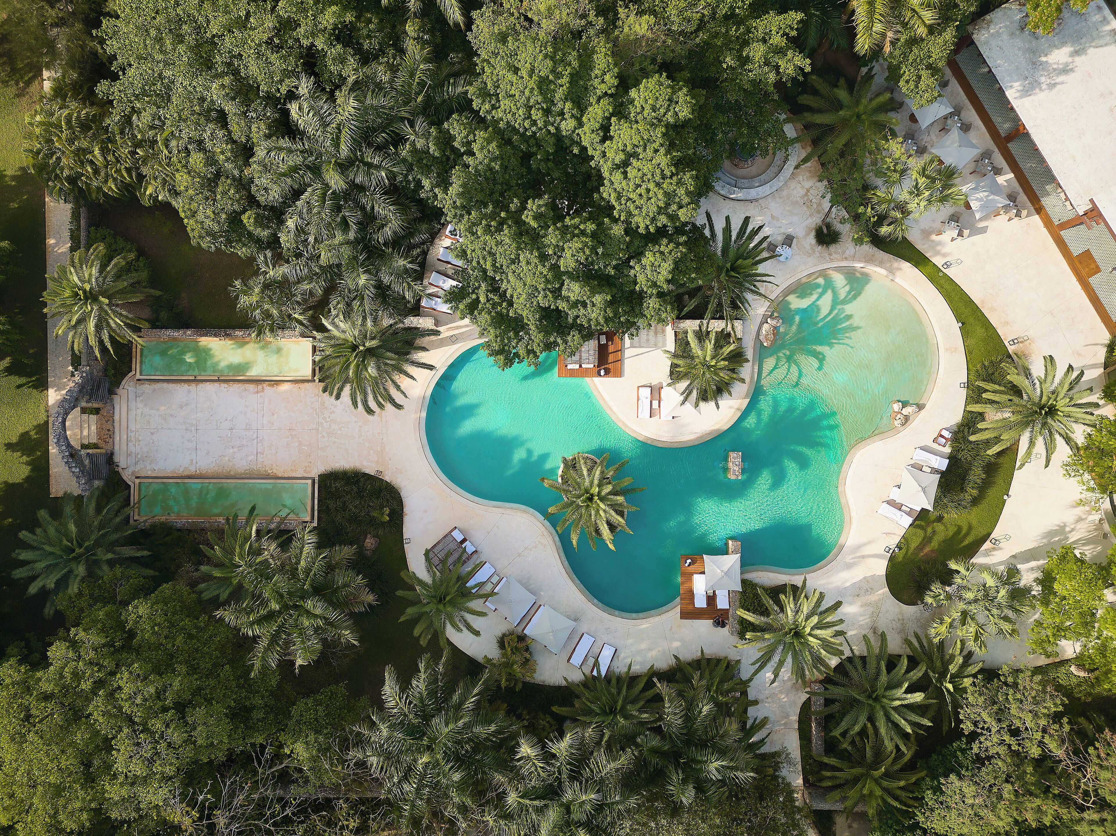 outdoor pool, open 7 am to 10 pm, pool umbrellas, pool loungers