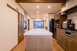 Furnished townhouse (for 1 group) with island kitchen and free bicycles | Private kitchen | Full-size fridge, microwave, oven, stovetop - Your Pavilion near Kinkakuji (Kyoto)