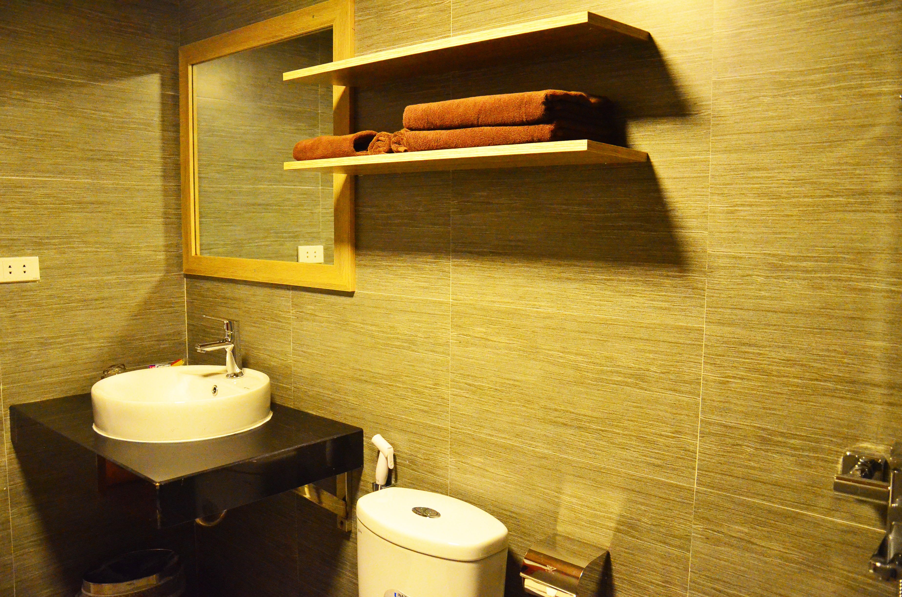 deluxe room with balcony | bathroom | shower, rainfall showerhead, free toiletries, hair dryer