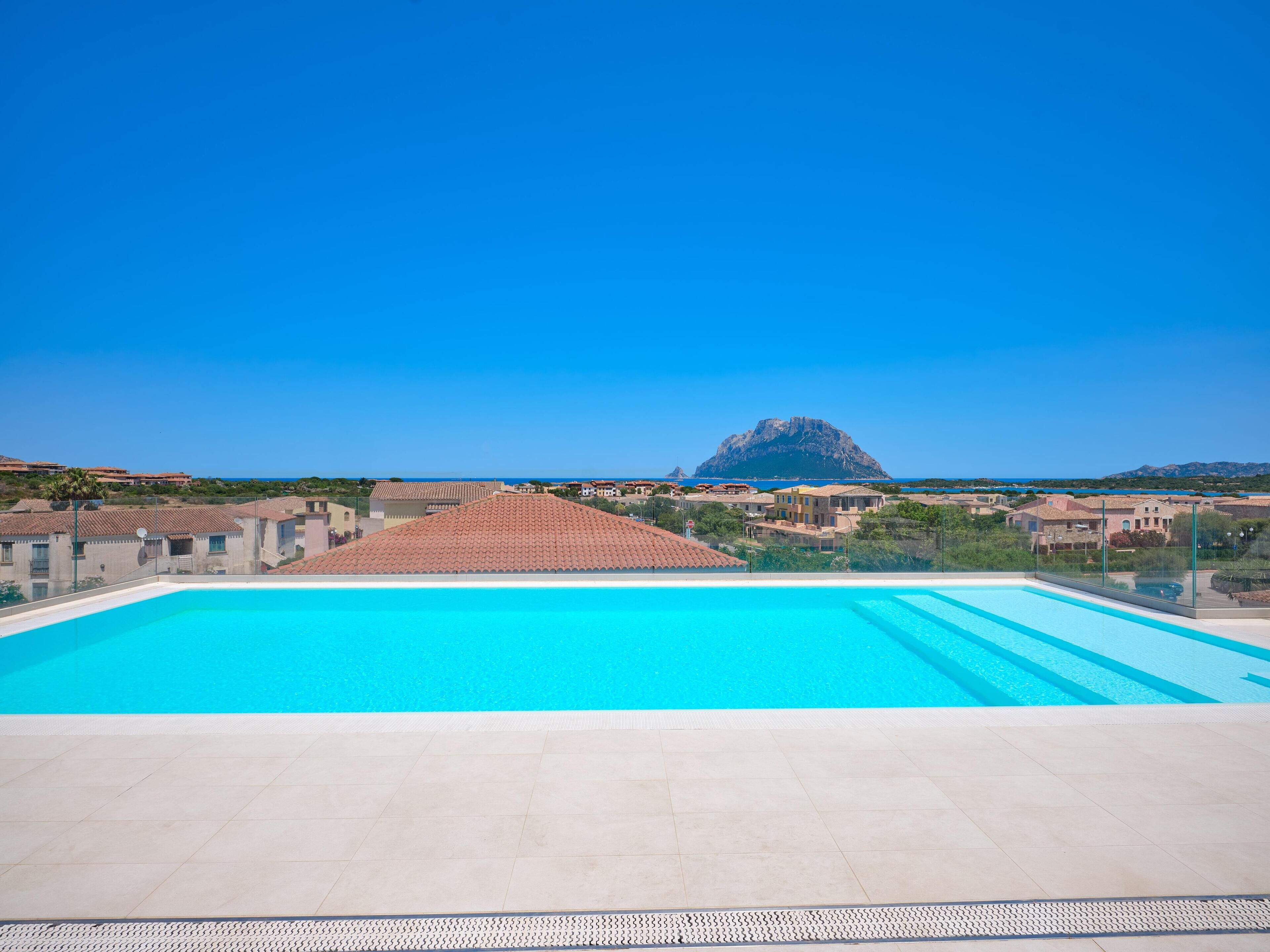outdoor pool, a rooftop pool, pool loungers