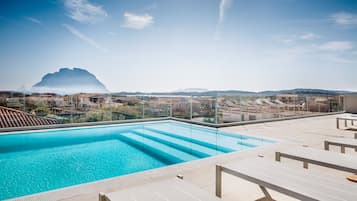 Outdoor pool, a rooftop pool, sun loungers