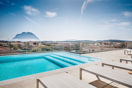 Outdoor pool, a rooftop pool, sun loungers