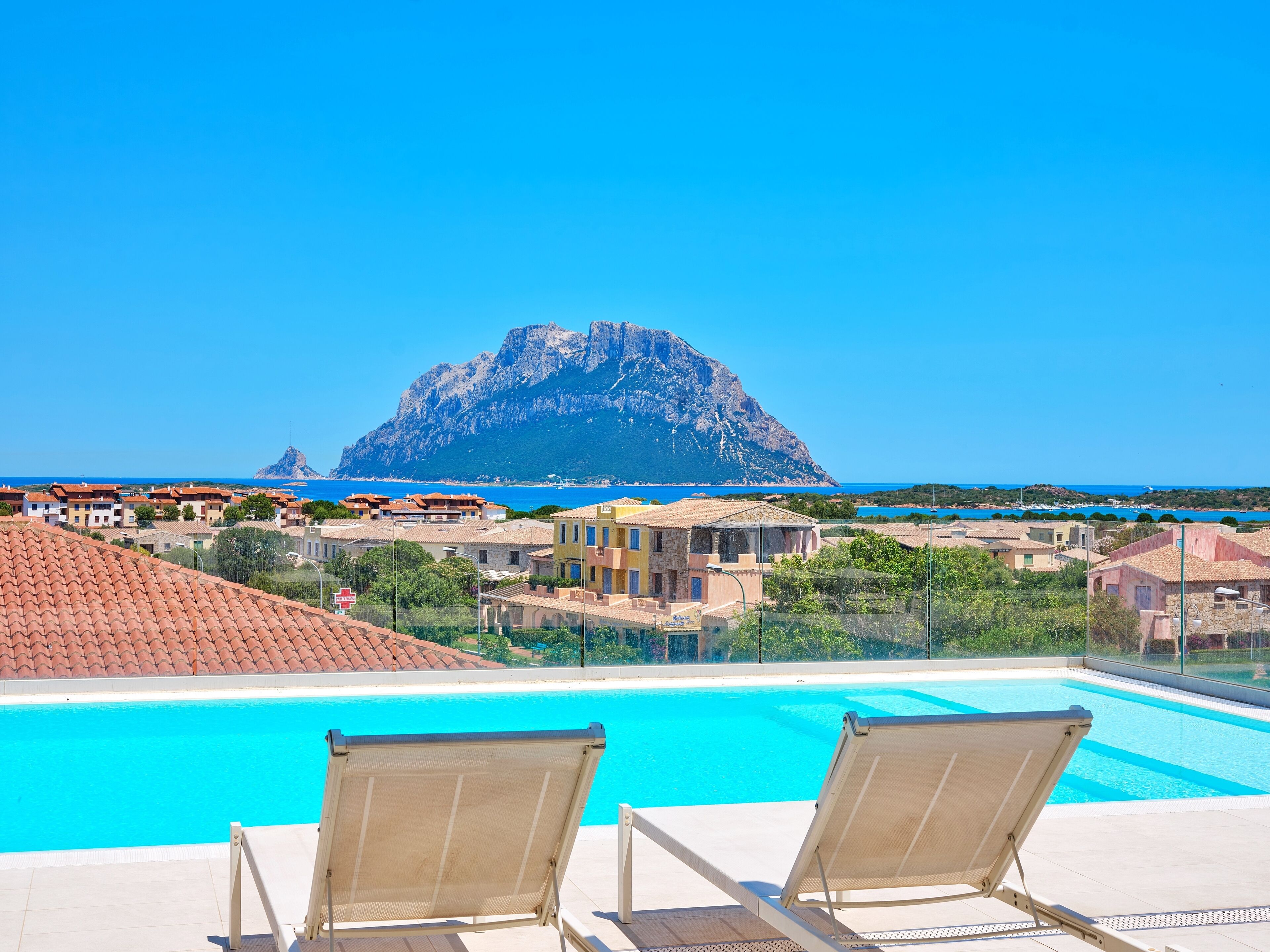 outdoor pool, a rooftop pool, pool loungers