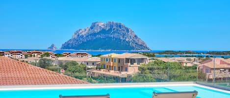 Outdoor pool, a rooftop pool, sun loungers