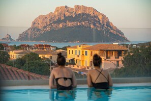 Outdoor pool, a rooftop pool, sun loungers