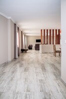 Executive Apartment | Living area | 32-inch flat-screen TV with satellite channels, TV