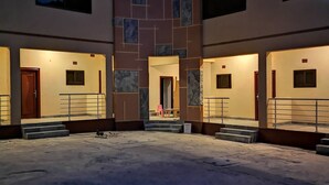 A building with multiple balconies and a central courtyard.