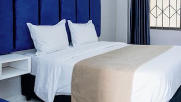 Deluxe Room | Premium bedding, down comforters, memory foam beds, in-room safe