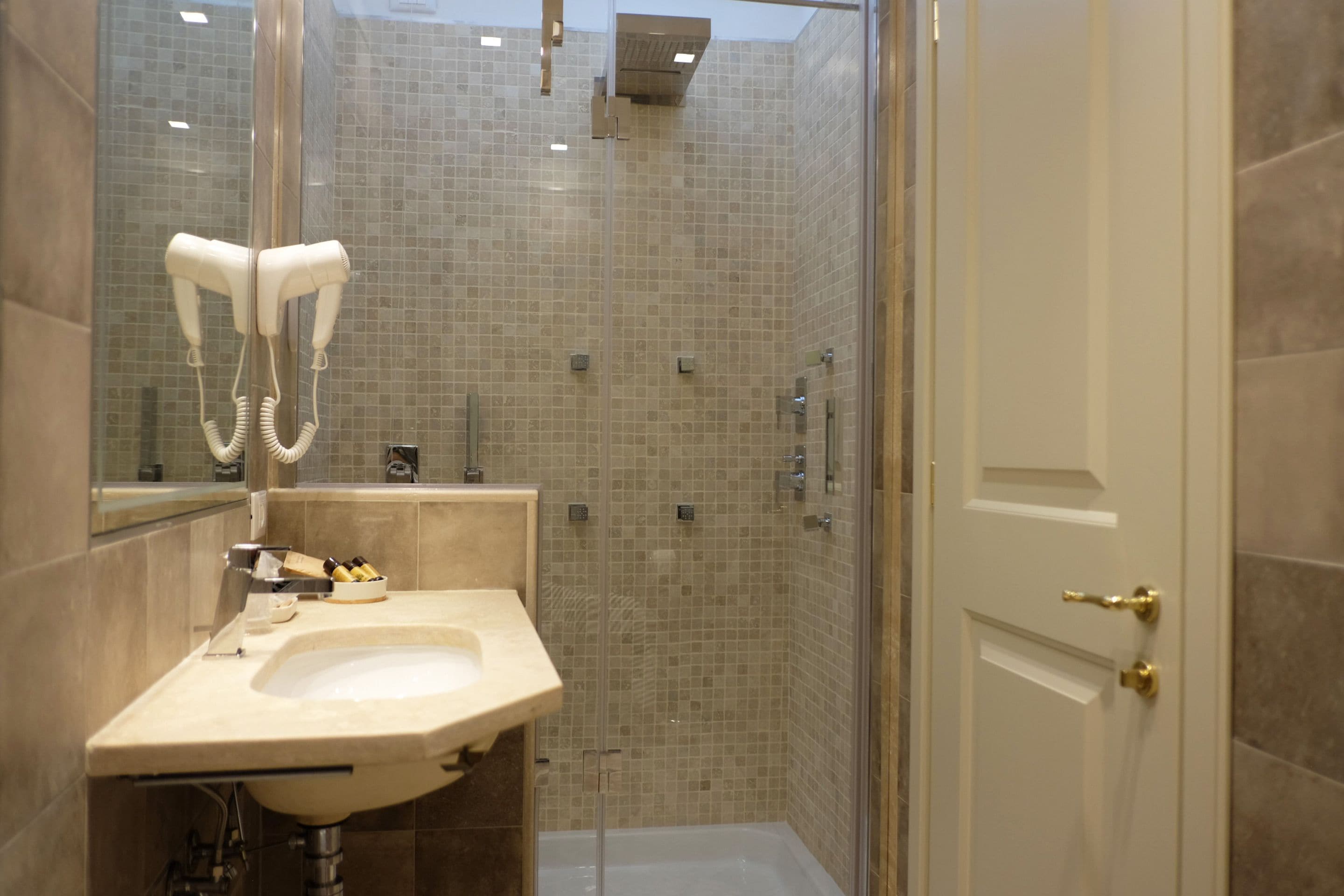 family room | bathroom | shower, hydromassage showerhead, eco-friendly toiletries, hair dryer