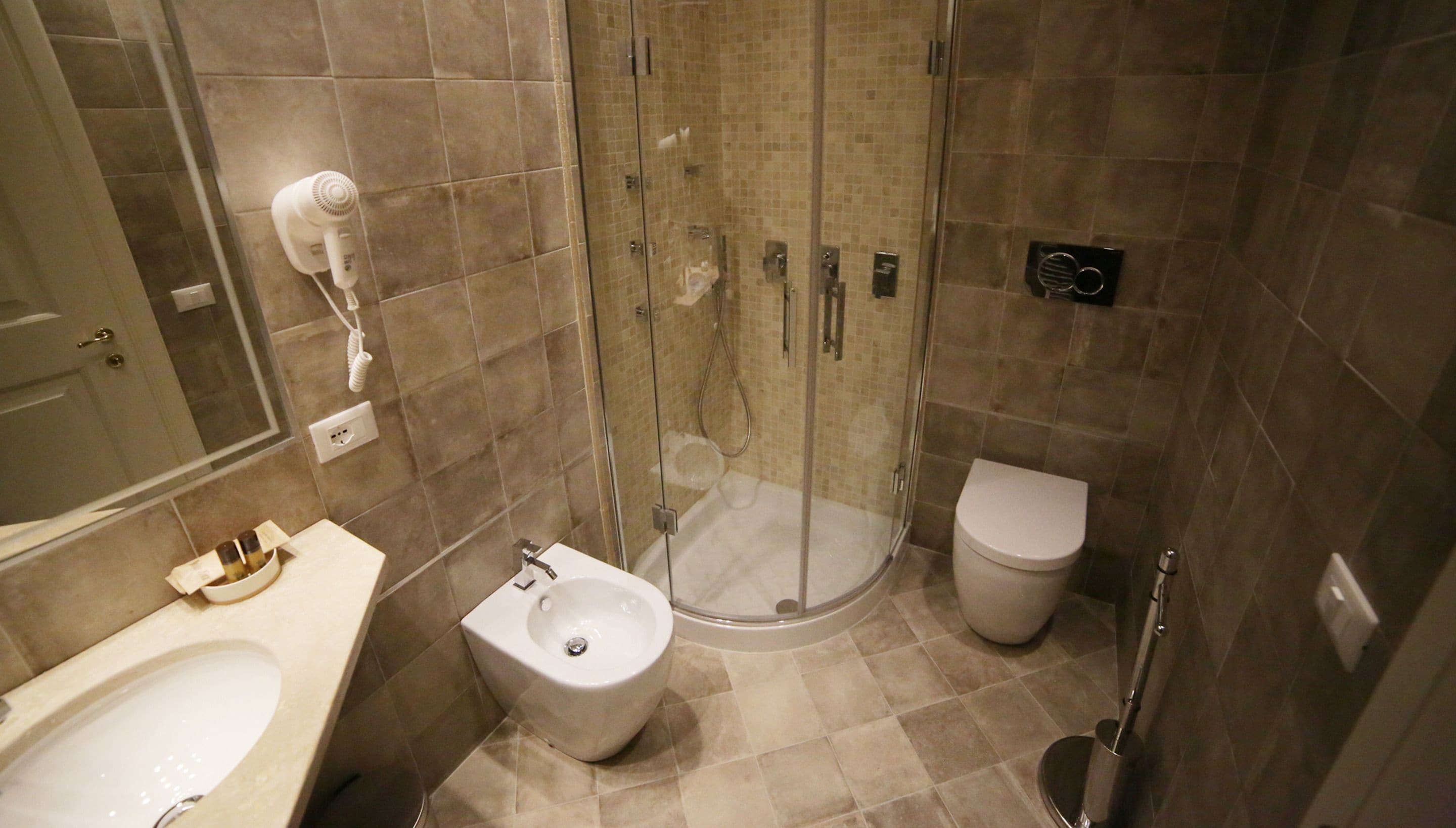 deluxe double or twin room | bathroom | shower, hydromassage showerhead, eco-friendly toiletries, hair dryer