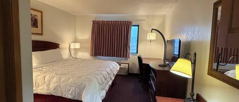 Deluxe Room, 1 Bedroom | Desk, blackout drapes, iron/ironing board, free WiFi