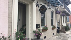 A historic building with a sign reading "W.G. Creole House" and a number "1724".