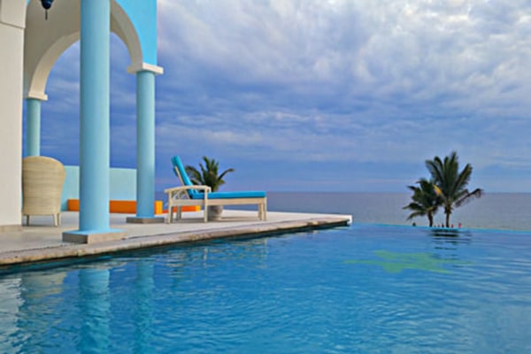 Outdoor pool, open 9:00 AM to 10:00 PM, pool umbrellas, sun loungers