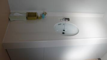 Combined shower/tub, free toiletries, hair dryer, slippers