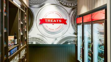 A wall with a circular design and the word 'TREATS' in a red banner.