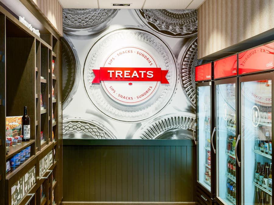 A wall with a circular design and the word 'TREATS' in a red banner.