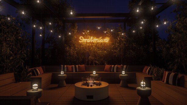 An outdoor seating area with a neon sign, round tables, and hanging lights. - Soratoniwa Atami Izusan (Atami)
